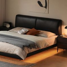 a bedroom with a bed, night stand and two nightstands