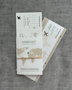 two boarding cards with a world map on one and a plane ticket on the other