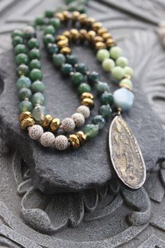 Green Jade Long Knotted Necklace with tribal buddha pendant - Gemstone long talisman necklace, gift for her Jade Jewelry With Natural Stones For Meditation, Spiritual Jade Jewelry With 108 Beads, Spiritual Gold Jade Beaded Necklaces, Spiritual Gold Jade Beaded Necklace, Jade Gemstone Beads Jewelry For Meditation, Spiritual Jade Medallion Necklace, Gold Jewelry With Hand-knotted Round Beads, Spiritual Jade Beaded Necklace As A Gift, Green Jewelry With 108 Beads For Festival