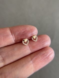 SCREW BACK/14K Solid Gold Tiny CZ Heart Stud Earrings- 14K Solid Gold Quantity: One Pair Color : Yellow Gold Materials : 14K Solid Gold Size : 6mm *14K Solid Gold will not tarnish. *Good for sensitive skin. * Metal components are 14K Solid Gold including earring backs. * Suitable for delicate and sensitive ears. * Comes in a jewelry box. If you need extra boxes for gifting....just let us know! Golden Small Earrings, Gold Trendy Earrings, Gold Delicate Earrings, Tiny Stud Earrings Gold, Ear Rings Studs Gold, Heart Gold Earrings, Cute Small Earrings Studs, Yellow Gold Diamond Heart Earrings, Rose Gold Heart Earrings With Diamond Accents