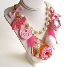 This kawaii statement necklace features tons of fun pink charms inspired by all things cute nostalgic and magical, making this necklace a true statement piece! I designed these charms to be so realistic you might be tempted to take a taste! This statement necklace features your choice of 5, 7 or 9 charms (pictured) that hang from a high quality gold or silver plated 20" chain necklace accented with a hand-beaded glass pearl chain and pink bow. Back closes with a lobster clasp and is finished wit Pink Fun Style Charm Necklace, Fun Pink Charm Necklaces, Harajuku Style Handmade Party Necklaces, Whimsical Pink Jewelry With Cute Design, Pink Playful Party Necklaces, Playful Pink Party Necklaces, Playful Pink Charm Necklaces, Playful Pink Necklaces For Party, Playful Pink Necklace For Party