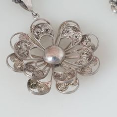 Antique Silver Filigree Pin Wheel Daisy Necklace A gorgeous and unique sterling silver pin wheel necklace,. The pendant is made from 2 silver filigree flower wheels and they turn like pinwheel - beautiful.  It is in a very good vintage condition and would make a stunning and unusual necklace. I will wrap your item to the extreme and will arrive to you beautifully gifted Happy to answer any questions you may have or provide extra photograph.  OVERSEAS WELCOME Pin Wheel, Unusual Necklace, Daisy Necklace, Silver Pin, Beaded Choker Necklace, Cat Necklace, Glass Bead Necklace, Silver Filigree, Beaded Choker