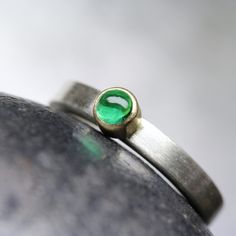 Modern Colombian Emerald Engagement Ring Solid Silver 18K Yellow Gold Minimalistic Green Cabochon - Beryl Dome by NangijalaJewelry on Etsy Modern Oval Green Jewelry, Minimalist Green Gemstone Ring, Modern Round Emerald Ring For Formal Occasions, Modern Emerald Ring With Polished Finish For Wedding, Modern Emerald Ring With Polished Finish, Modern Emerald Ring With Bezel Setting For Formal Occasions, Modern Emerald Ring With Bezel Setting For Formal Events, Minimalist Oval Emerald Ring With Bezel Setting, Modern Formal Emerald Ring With Bezel Setting