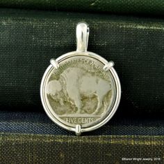 "This is a custom order item. Your order will ship within 3-5 business days of payment confirmation. The coin pendant in the listing photos is an example of the finished piece. Excluding the year on the coin, your coin pendant will be the same design as the pictured pendant. Each pendant setting is made by hand (not a machine), and no two coins are exactly alike. If you are looking for a specific year, let me know, I may have it in my collection. This Buffalo Nickel rests in a handcrafted settin Untreated Sterling Silver Round Pendant, Heirloom Style Sterling Silver Nickel-free Jewelry, Heirloom Style Nickel-free Sterling Silver Jewelry, Untreated Sterling Silver Collectible Jewelry, Handmade Sterling Silver Necklace For Commemoration, Vintage Silver Necklace For Everyday, Silver Vintage Necklace For Everyday, Engraved Round Pendant Jewelry For Everyday Use, Everyday Engraved Round Pendant Jewelry