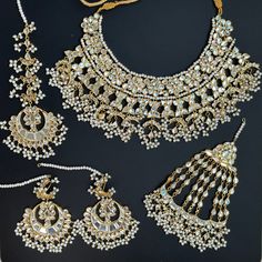 an assortment of necklaces and earrings on display