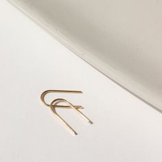 Simple and effortless, yet anything but basic, our 14k gold Arches minimal design means endless wear for everyday style. A great earring for sensitive ears and a must-have addition to your fine jewelry collection. DETAILS14k Solid GoldApprox. 0.5" dropHypoallergenic, Nickel Free and Water Safe Simple Design 14k Gold Earrings, Minimalist 14k Gold Jewelry For Everyday, Minimalist Small Hoop Jewelry For Everyday Elegance, Classic Everyday Hoop Earrings In Recycled Gold, Minimalist 14k Gold Filled Jewelry For Everyday, Minimalist 14k Gold Filled Jewelry For Everyday Elegance, Tiny 14k Gold Hoop Earrings For Everyday, Classic 14k Gold Filled Earrings For Everyday Luxury, Adjustable Minimalist Yellow Gold Earrings