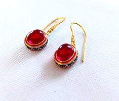 Golden plated Earrings Red Carnelian Gem. Coloured Cloisonne enameled. High quality.    Handmade ethnic antique design egyptian style ring Metal Type - 18k Gold plated Gem Colour - Red The earrings are delivered with a jewelry box.  Combined shipping! Brass Meenakari Earrings Gift, Meenakari Brass Earrings Gift, Red Enamel Round Earrings, Red Round Enamel Earrings, Ornate Red Cabochon Jewelry, Red Vintage Earrings For Festivals, Ceremonial Red Gemstone Jewelry, Red Ceremonial Earrings For Festivals, Red Enamel Jewelry With Gemstone