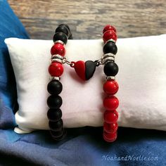 "🤍 Magnetic Heart Bracelet Sets 🤍 Now available in: ❤️🖤 Red Turquoise & Matte Black Onyx 💙🤍 Blue Spot Jasper & White Howlite 💜💜 Purple Sea Sediment Colorful Imperial Jasper 🖤🖤 Black Snowflake Obsidian ⭐️ Sold as a set of 2. Price is for the pair.  📏 Bracelet pictured is size 7\" with a stretch band (medium size), but can be made to order by request." Black Heart-shaped Couples Bracelets, Handmade Black Bracelets For Valentine's Day, Handmade Black Bracelet For Valentine's Day, Couples Black Heart Bracelets, Couples Black Heart-shaped Bracelets, Red Heart-shaped Bracelets For Valentine's Day, Red Heart Bracelets For Friendship, Black Heart Bracelets With Heart Charm, Gift Black Heart Beads Bracelet