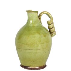 a large green vase with a handle on the top is shown in front of a white background