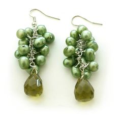 Look lovely and elegant with our Green Cluster Dangle Earrings with Crystal. The cluster of green synthetic pearls has a fresh and simplistic feel that will go great with any ensemble. The multi-faceted crystal at the bottom adds charm to the earrings. Wear them to a cocktail party or a wedding! Earrings 2.5"L x 1.75"W. Green Drop Crystal Earrings For Party, Green Dangle Pearl Earrings, Green Pearl Dangle Earrings, Green Pearl Drop Jewelry, Green Pearl Jewelry For Party, Elegant Green Beaded Crystal Earrings, Green Pearl Earrings For Wedding, Elegant Lime Green Dangle Earrings, Green Pearl Earrings As Gift