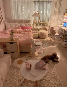 a bedroom with white furniture and pink bedding