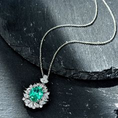 This elegant necklace features a beautiful lab-created paraiba. The necklace is designed to enhance any outfit and is sure to be a timeless addition to your jewelry collection. Features The necklace in sterling silver has a classic and luxurious design that is perfect for any occasion. Made all by hand! It truly deserves a spot in every jewelry collection. Beautifully crafted, this style is sure to become a treasured keepsake. It is made of 925 sterling silver. Made to last a lifetime, strong an Sapphire Side Stones, Box Necklace, Paraiba Tourmaline, Party Necklace, Elegant Necklace, Creating Jewelry, Necklace Box, Elegant Necklaces, Diamond Pendant Necklace