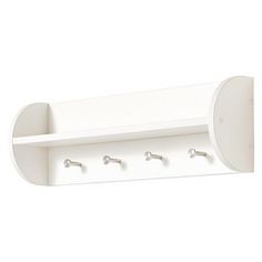 a white wall mounted shelf with three hooks