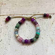 These bracelets and necklaces are a collection based around a rainbow of gemstone pony beads. Add-on stones can be purchases additionally here, please specify if you want your add on strung on your bracelet in the personalization comments. If left blank it will be sent separately: https://www.etsy.com/listing/946252171/bracelet-add-ons?ref=shop_home_active_4 All of my cords are one size fits all. Stones are subject to availability and may be substituted when necessary. Precious gems are formed in different ways and composed of different materials, meaning their appearances vary vastly. Gems may be treated to enrich color. Recommended to be stacked with many! Beaded with love ❤️. Bracelets And Necklaces, Season Of The Witch, Gemstone Beaded Bracelets, The Witch, Pony Beads, Add Ons, Precious Gems, A Rainbow, Shop Home