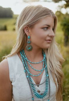 Holy moly these earrings are stunning! They are a 3.5", 3 Tier Burnished Silver and Turquoise Flower Concho Earrings on Turquoise Post earring! Made by west + co out of Texas! These complete your dressy outfit and we have so many necklaces that will style perfect with them! Southwestern Style Turquoise Dangle Necklace, Turquoise Dangle Necklace, Turquoise Jewelry With Matching Earrings, Turquoise Jewelry With Matching Earrings For Summer, Bohemian Turquoise Dangle Necklace, Bohemian Turquoise Necklace For Summer, Southwestern Blue Jewelry For Summer, Southwestern Dangle Jewelry For Summer, Blue Southwestern Style Jewelry For Summer