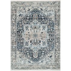 a blue and beige rug with an intricate design on the middle, in front of a white background