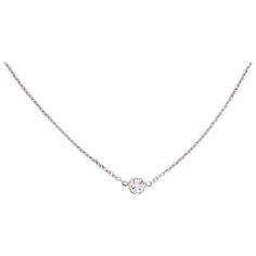 This 14 karat white gold diamond bezel necklace is a classic! This simple design is one to be worn everyday and with any outfit. You can wear it with your finest dress and also in your workout clothes. The diamond is lovely and shines from any angle. If you have seen the traditional Tiffany & Co. Diamond necklace your will realize what a good value you this one is. 18 inch long chain, diamond cut cable chain 0.30 carat diamond I-1 Clarity and G Color-Excellent Quality Diamond Necklace Simple Tiffany, Delicate Luxury White Gold Chain Necklace, Luxury Dainty White Chain Necklace, Luxury White Dainty Chain Necklace, Luxury Everyday White Gold Necklace, Luxury White Necklace With Single Diamond, 1 Carat Necklace Tifannys, Tiffany N Co Necklace, Tiffany Diamond Earrings