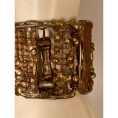 This is part of Chairish's Costume Jewelry Collection.  A striking cuff bracelet composed of hand made panels of brass and bronze by Pal Kepenyes in several different brutalist designs is from the same estate as the Milagros necklace.  This piece is unsigned and at some point the previous owner replaced the clasp.  It is in good, unsigned condition. Measurements; Length 7"    Width 1.75" Hand Forged Gold Brutalist Jewelry, Hand Cast Metal Brutalist Jewelry, Brutalist Hand Forged Gold Jewelry, Hand Cast Brutalist Metal Jewelry, Brutalist Hand Cast Metal Jewelry, Antique Bronze Metal Bracelets, Gold Brutalist Hand-cast Jewelry, Brutalist Hand-cast Gold Jewelry, Brutalist Brass Jewelry In Bronze