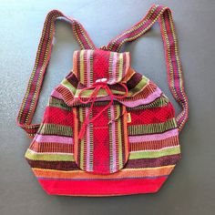 This Beautiful Nwot 2018 Pinzon Artesanias Backpack Is A Must-Have For Anyone Who Loves Unique And Colorful Accessories. With A Striking Red, Green, Orange, Purple And Brown Striped Pattern And Aztec Theme, This Medium-Sized Bag Is Perfect For Everyday Use. The Drawstring Closure And Shoulder Strap Handle Make It Easy To Carry, While The Zippered Pocket Provides Extra Storage Space. Made From Knit Fabric In Mexico, This Backpack Is A Perfect Blend Of Style And Durability. The Bag Width Is 15.75 Mexican Blanket, Medium Sized Bags, Colorful Accessories, Running Errands, Stripes Pattern, Drawstring Backpack, Knitted Fabric, Backpacks, Purple