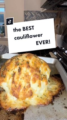 a cheesy baked cauliflower in a baking pan