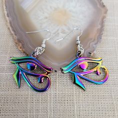 Eye of Ra Earrings, Iridescent Titanium Rainbow Plated, Dangle Drop Earrings, Egyptian Jewelry * Moderately weighty earrings. * French earwires that are lead and nickel free. * Ships is a gorgeous box ready for gift giving. * To lengthen the life of your jewelry, do not shower or bathe with it on. * Your item will ship between 1-2 business days. * Priority Shipping is available at checkout. Compass Jewelry, Eye Of Ra, Compass Design, Egyptian Jewelry, Spike Earrings, Free Earrings, Moon Earrings, Rolo Chain, Silver Earrings Dangle