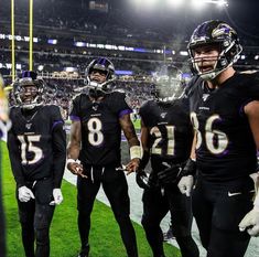 the baltimore football team is standing on the field