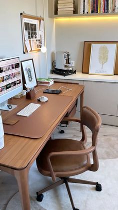 an office desk with two computer monitors on it