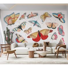 a living room filled with furniture and lots of butterflies on the wall