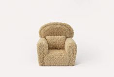 a chair made out of sheepskin on a white background