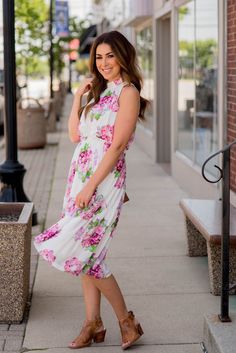 This fun and feminine floral tank dress has a cinched neck and waist and a flowy bottom to fit any and every body shape or size! Pair this with sandals in the warmer months or add a cardigan or denim jacket and booties in the cooler ones! We love that this can be styled for a more elevated occasion or worn casually for an everyday look! Spring Floral Dress With Smocked Back, Spring Floral Dress With Smocked Back And Flowy Fit, Spring Floral Midi Dress With Smocked Back, Flowy Spring Floral Dress With Smocked Back, Summer Floral Dress With Smocked Back For Brunch, Spring Midi Floral Dress With Smocked Back, Chic Floral Dress With Smocked Back For Spring, Summer Floral Dress For Brunch With Smocked Back, Casual Floral Dress With Smocked Back For Brunch