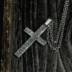 describe This 925 Silver Cross Necklace, Cross Pendant, Gothic Cross, Gothic Jewelry is cast in sterling silver and bronze and handcrafted to accentuate every nook and cranny of this wonderful sculpture. Pendant length approximately 62mm* width 32mm Note: Dimensions and weights are measured by hand and may vary. pack: All pieces come in custom gift boxes. If you would like to include a gift note, please let us know in the Notes section at checkout. Please click to view other products in our stor Artisan Carved Sterling Silver Jewelry, Memorial Sterling Silver Jewelry With Oxidized Finish, Unique Sterling Silver Cross Necklace, Artisan Silver Carved Jewelry, Artisan Carved Silver Jewelry, Artisan Silver Engraved Necklaces, Handmade Silver Cross Pendant Necklace, Handmade Silver Necklace With Cross Pendant, Antique Silver Cross Necklace In Sterling Silver