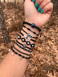 "Minimalist and simple black bracelets 🖤 Materials: nylon, resin, 18k gold plated over brass beads (nickel free) river shell heart charm, cultured pearl, glass eye, glass butterfly, 14k gold plated evil eye and hamsa hand. Bracelet size: 6\" with sliding knot closure and completely adjustable to fit any wrist. 💕 Most of my bracelets are 1/2 cm wide(thick) some are 1 cm. 💕 Message me with any questions or different sizing prior to purchase 💕. Remember that handmade pieces are always unique an Trendy Black Jewelry For Gifts, Handmade Black Jewelry For Friendship, Adjustable Black Jewelry Gift, Adjustable Black Jewelry For Gifts, Black Bohemian Braided Bracelets For Everyday, Handmade Black Jewelry For Everyday, Adjustable Black Bracelet For Everyday, Minimalist Black Bracelet Jewelry, Black Handmade Jewelry For Everyday