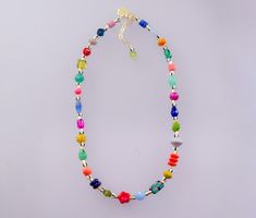 Brighten up your look with this colorful handmade necklace. It features a mix of vibrant Czech beads, natural gemstones, glass beads, and unique handpainted beads. Length: 16 inches with 2-inch adjustable chain. *Beads may vary slightly Colorful Adjustable Beaded Necklace With Polished Beads, Colorful Adjustable Beaded Necklaces With Polished Beads, Handmade Multicolor Crystal Necklace For Festivals, Festival Multicolor Crystal Necklaces With Colorful Beads, Festival Multicolor Crystal Necklace With Colorful Beads, Vibrant Rainbow Beaded Necklace As Gift, Vibrant Rainbow Beaded Necklace For Gift, Multicolor Beaded Crystal Necklaces In Czech Glass, Adjustable Multicolor Crystal Necklace With Colorful Beads