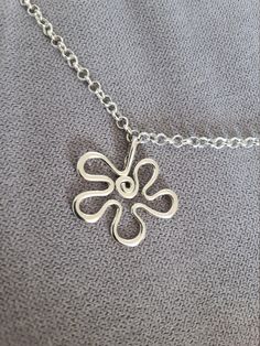 The nicest flower pendant can be a nice gift for your friend, a loved one or to your mom. It can also be used as a decorative detail on the bundle of keys, or as necklace pendant, or - anything else on your idea. It will be sold together with a fixed ring and a lobster. The pendant is about 3.7 cm (1.45 inches) hight and 4 cm wide (1.57 in). The thickness is 3mm (0.1in). This nice jewellery accessory can be a matching gift to those who love flowers and nature.  If this gift is supposed to be pre Charming Flower Charm Necklaces For Gift, Charming Flower Charm Necklace Gift, Charming Dangle Charm Necklaces For Gifts, Charming Flower Charm Jewelry As Gift, Charming Flower Charm Jewelry For Gift, Flower Charm Necklace For Her, Flower Charm Pendant Necklace As Gift, Flower Charm Pendant Necklace Gift For Mom, Personalized Bohemian Charm Necklaces As Gift