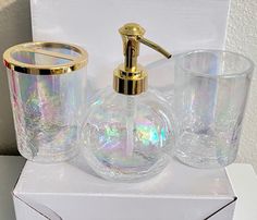 a bathroom set consisting of soap dispenser, toothbrush holder and glasses