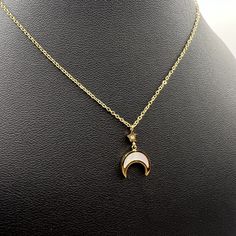 18K Gold Dainty Moon Necklace,  Gold Moon necklace, Crescent Half Moon Gold Chain, Pearl Moon Pendant, Waterproof Necklace  Material:   - 18K PVD Gold Plated  - Hypoallergenic  - Waterproof  - Non-Tarnish -High-Quality Gold Plating Measurements:  Chain: 40 cm plus 6.3 adjustability  Pendant: 1.3 cm x 1.2 cm   How to Care for your Jewellery so they will last longer:  - Wipe the jewellery clean every time after wearing  - Store gold jewellery separate from other jewellery  - Keep jewellery away fr White Moon Phase Necklace, White Moon-shaped Clavicle Necklace, White Moon Charm Necklace, White Half Moon Necklace With Moon Charm, Dainty Moon Necklace, Waterproof Necklace, Moon Necklace Gold, Moon Gold, Gold Moon Necklace