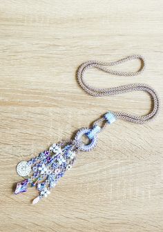 This long necklace is all hand sewn, and made with various kinds of beads. The focal point are the strands, finished with beautiful glass cabochons and a mandala charm. It will be shipped with an organza bag and shipped with a tracking number in a padded envelope. For more necklaces please check: https://www.etsy.com/shop/CinziaDesign?section_id=15986977&ref=shopsection_leftnav_4 My shop: https://www.etsy.com/shop/CinziaDesign?ref=hdr_shop_menu Bohemian Beaded Lariat Necklace, Bohemian Lariat Necklace With Beaded Chain, Handmade Lariat Festival Necklace, Handmade Festival Lariat Necklace, Bohemian Long Necklace With Faceted Beads As Gift, Festival Beaded Lariat Necklaces, Bohemian Lariat Necklace With Colorful Beads, Bohemian Lariat Necklace With Dangling Beads, Handmade Bohemian Beaded Lariat Necklace