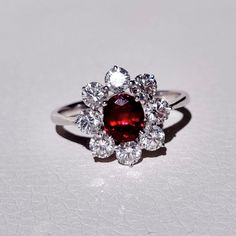 Art Nouveau inspired design which helped me create a majestic and classic piece. Made of solid 18k white gold, adorned with a beautiful natural 1.42 ct pigeon blood ruby and highlighted by 1.35 ct F color and VVS2 - VS1 clarity natural diamonds.  The ring is ready to ship, so if you feel this was made for you, drop us a message with the perfect size and don't forget about the phone number for the courier! The design can be recreated with a gemstones of your choosing. RING MEASUREMENTS: Total wei Ruby Engagement Ring White Gold, Luxury Ruby Gemstone Ring In Platinum, 14k White Gold Ruby Ring With Halo Setting, Luxury Ruby Ring With Platinum Center Stone, Luxury Platinum Ruby Ring With Center Stone, Luxury Brilliant Cut Cubic Zirconia Ruby Ring, Luxury Platinum Ruby Ring With Prong Setting, Luxury Diamond White Ruby Ring, Luxury Platinum Ruby Ring With Brilliant Cut