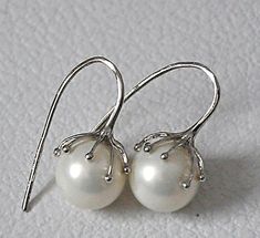 "Shop Large Pearl Drop Earrings Sterling Silver, Bridal Bohemian Jewelry Stunning 12 mm White Shell Pearls clasped in sterling silver tentacle ear wires evoke a modern twist to an old classic. These earrings are 1\" long. White pearl earrings will match any color of your dress. These drop earrings will make a great gift for a bride. Your order will be mailed within 2 business days, nicely packaged, ready to be given. All US orders and most international orders will have a tracking#. To see more Adjustable Delicate Silver Earrings, Elegant Sterling Silver Pearl Earrings With Ear Wire, Elegant Sterling Silver Pearl Earrings Nickel Free, Elegant Sterling Silver Nickel-free Pearl Earrings, Dainty Silver Pearl Earrings For Gift, Nickel Free Pearl Earrings For Anniversary, Delicate Nickel-free Round Pearl Earrings, Silver Dainty Pearl Earrings For Formal Occasions, Silver Round Pearl Earrings As A Gift