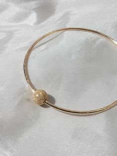 Thick 14G bangles with 1 gold filled accent beads. Available in 16G for $10 less. Also available in silver, just message me. Available in silver for $35. Looks great paired with other bangles. https://www.etsy.com/listing/106162524/custom-14g-bangle-gold-filled Found some special shells on your vacation and want to create a special piece; we can work together to make something you love!! Custom orders welcome, just message me. All jewelry come gift wrapped. Tahitian Pearl Ring, Baby Bangles, The Bangles, Pearl Bangle, Puka Shell, Tahitian Pearls, Bangle Set, Shell Necklaces, Star Charms