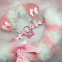 a pink and white fur collar, bow tie, and matching hat for a baby girl