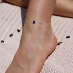 A delicate anklet with blue evil eye bead - as fine as can be, must-have for the summer season. Protect me - Evile eye. Made of high-quality 925 sterling silver. arrive with 3 cm extender chain You will receive a 1-year warranty. Item will arrive in pretty gift packaging, ready to give. 0.6 mm sterling silver Cardano chain. Lobster clasp. available in 2 lengths: 20 cm + 3 cm extender chain 23 cm + 3 cm extender chain Dainty Sterling Silver Anklets For Summer, Handmade Minimalist Anklet For Gift, Minimalist Handmade Anklet As Gift, Minimalist Handmade Anklet For Gift, Dainty Adjustable Sterling Silver Anklets, Minimalist Hypoallergenic Sterling Silver Anklets, Adjustable Hypoallergenic Sterling Silver Anklets, Minimalist Anklet, Black Anklet