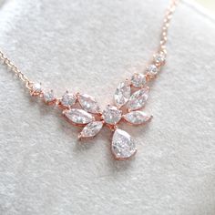 A dainty yet glamorous bridal necklace to add a touch of romance to your wedding! This rose gold necklace features an array of intricately cut cubic zirconia stones that shine brilliantly!Perfect for the bride or a bridal party !- Available in rose gold, yellow gold or rhodium finish- 17" (Length) - 1/16" (Width)- 3/4" (Drop) This is an original design by © Treasures by Agnes Delicate Rose Gold Bridal Necklace For Party, Delicate Rose Gold Backdrop Necklace For Wedding, Backless Dress Wedding, Rose Gold Backdrop, Bridal Backdrops, Bridal Backdrop Necklace, Backdrop Necklace, Rose Gold Wedding Jewelry, Gold Backdrop