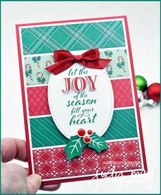 someone is holding up a christmas card that says, let the joy season felt your heart