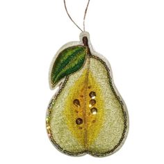 a glass ornament with a yellow and green leaf hanging from it's side