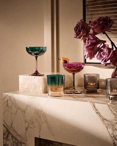 Notes of grand hotels and fine champagne— Pieces like the always classic Eve Coupe and Nordic-inspired Silhuet Barware by Aurélien Barbry evoke a five-star experience. Colored Glassware, Dining Rooms, Barware