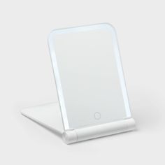 an electronic device with a white surface on it's back end and side view