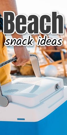 a person is using a blue and white cooler with the words beach snack ideas on it