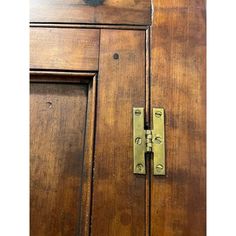 an old wooden door with a latch on it