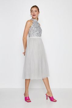 Unleash your inner princess with this midi dress. Taking you to the ball (or wherever else you fancy) in style, it features a halterneck sequinned bodice, banded waist and floaty tulle skirt.Style: Full Skirted DressDesign: PlainFabric: MeshLength: MidiNeckline: HalterneckSleeve Length: Sleeveless Pleated Skirt Outfit, Dresses Sequin, Fab Dress, Dress Silver, Halter Midi Dress, Skirt Outfit, Silver Dress, Skirt Outfits, Sequin Dress